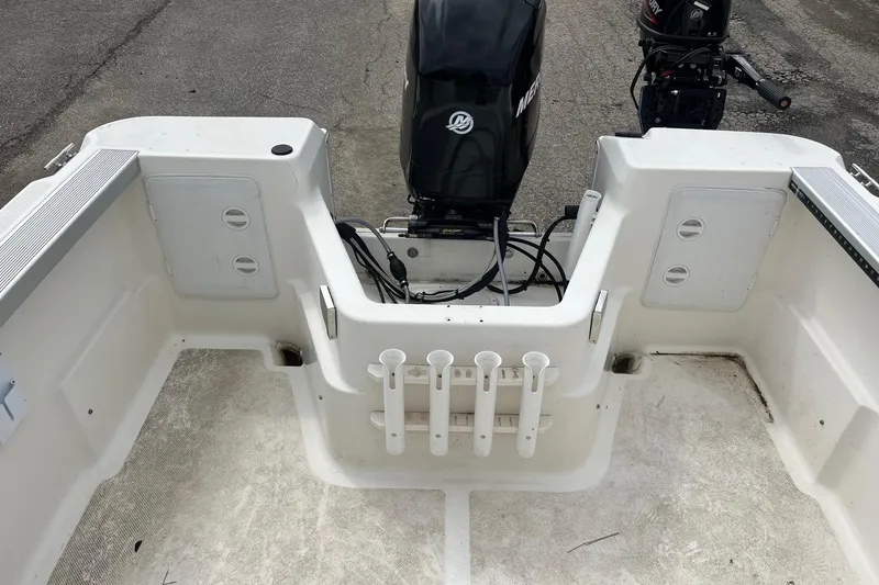 Slide: The Image of 2010 Trophy 1802 Walkaround boat interior with Mercury outboard motor. - 7