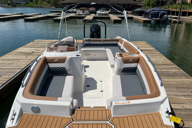 Slide: The Image of 2026 Starcraft SVX 211 OB boat docked, featuring spacious seating and modern design. - 4