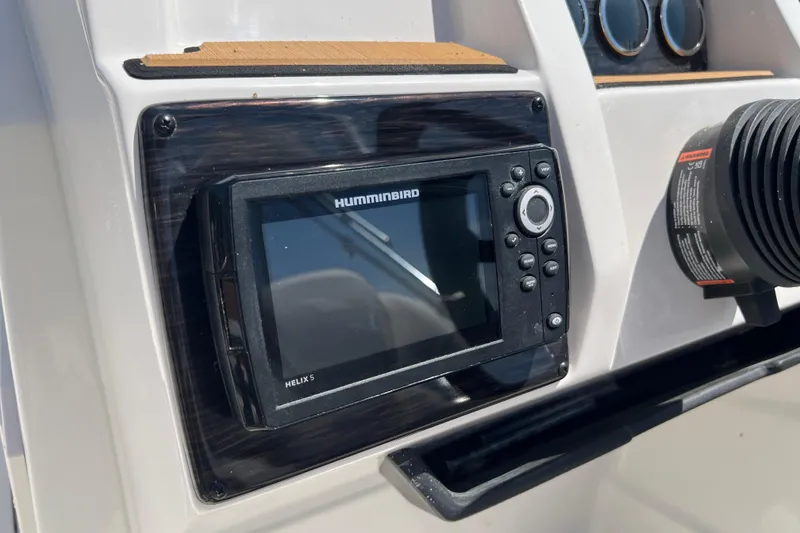 Slide: The Image of Helix 5 fish finder on 2026 Starcraft SVX 211 OB boat dashboard. - 8
