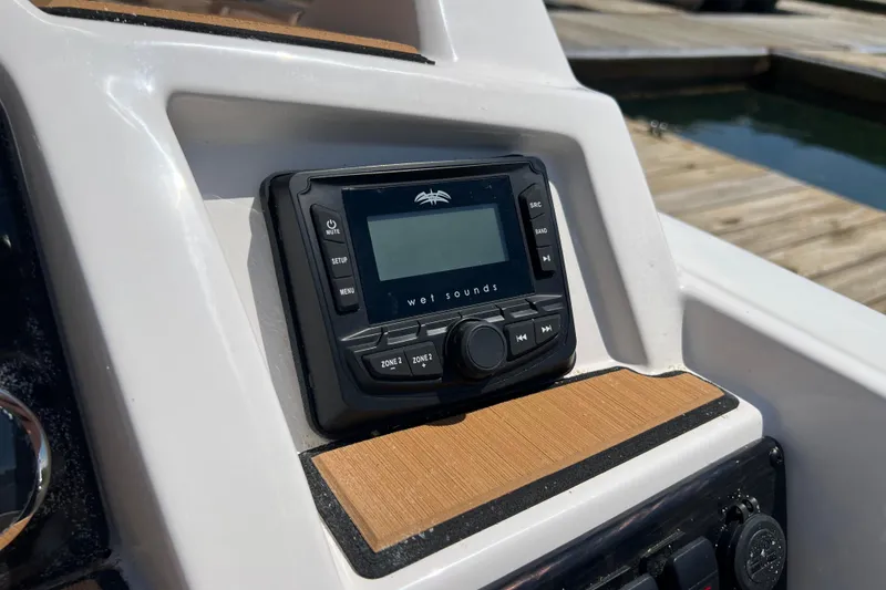 Slide: The Image of 2026 Starcraft SVX 211 OB boat dashboard featuring a Wet Sounds audio system. - 9