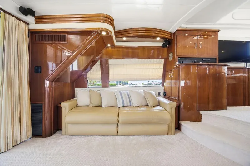 Slide: The Image of Luxurious 2006 Marquis 59 yacht interior with elegant wood finishes and comfortable seating. - 11