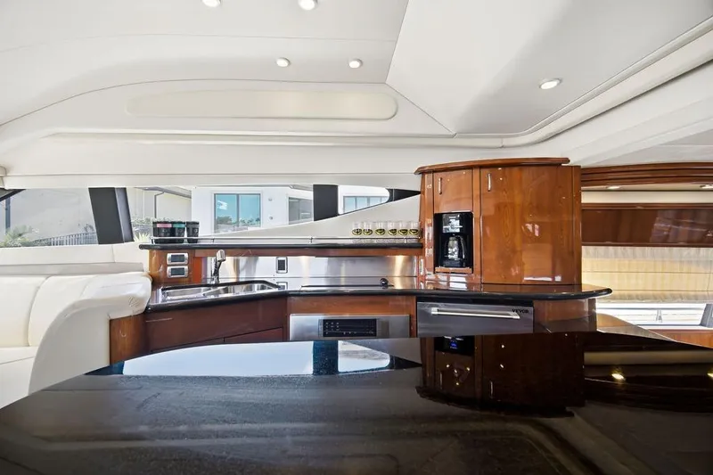 Slide: The Image of Luxurious interior of a 2006 Marquis 59 yacht with sleek wood finishes and modern amenities. - 12