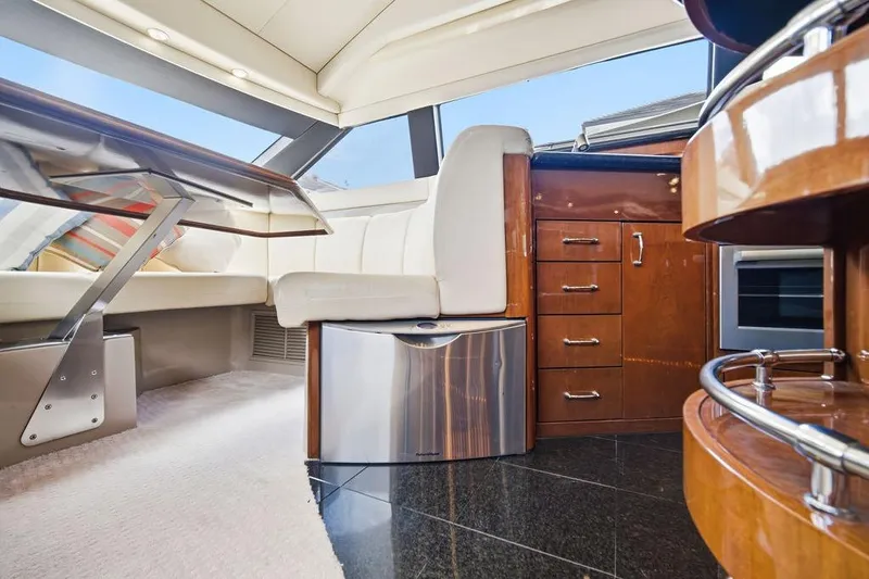 Slide: The Image of Luxurious interior of a 2006 Marquis 59 yacht with elegant wood finishes and modern amenities. - 17