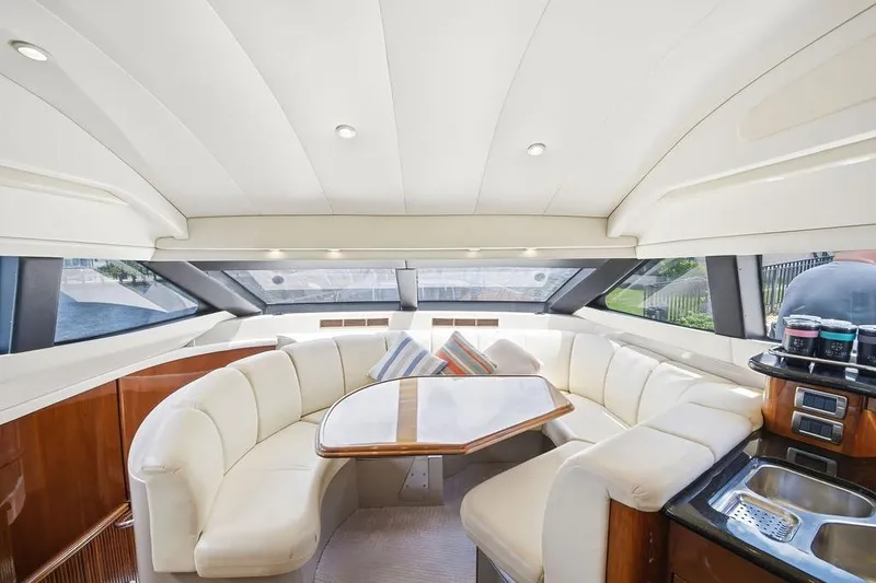 Slide: The Image of Luxurious interior of a 2006 Marquis 59 yacht with plush seating and modern amenities. - 20