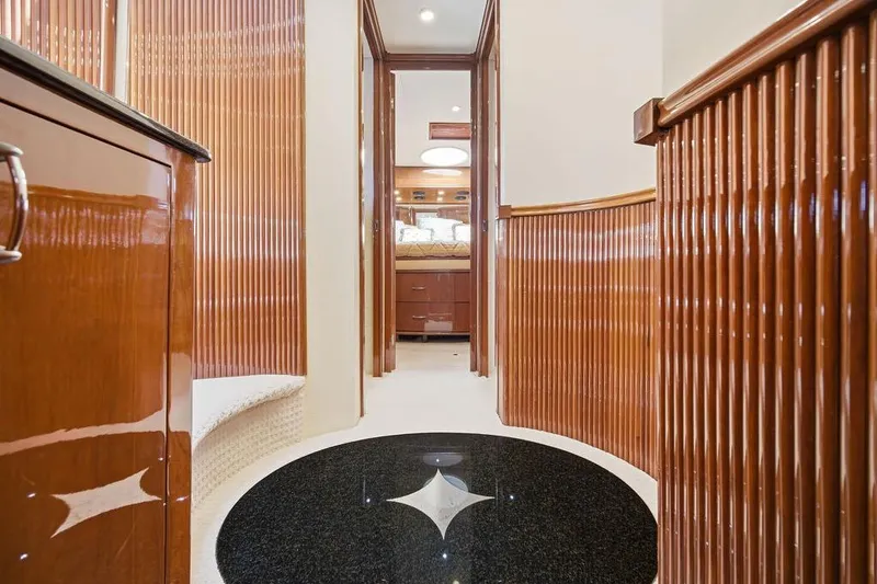 Slide: The Image of Luxurious interior of a 2006 Marquis 59 yacht with polished wood finishes. - 26