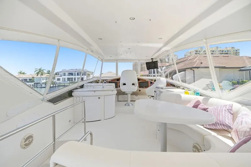 Slide: The Image of Luxurious 2006 Marquis 59 yacht interior with modern seating and panoramic windows. - 39