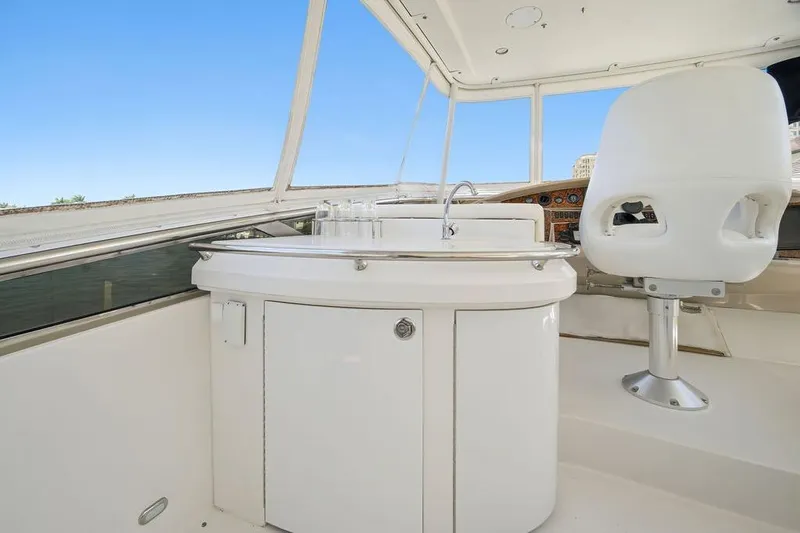 Slide: The Image of Interior of 2006 Marquis 59 yacht with helm and seating area. - 42