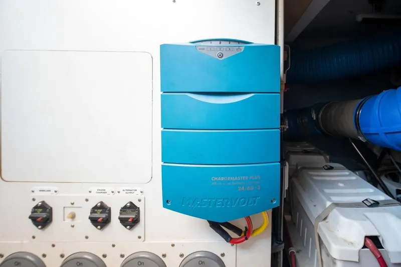 Slide: The Image of Electrical panel with Mastervolt ChargeMaster Plus in 2006 Marquis 59 yacht engine room. - 53