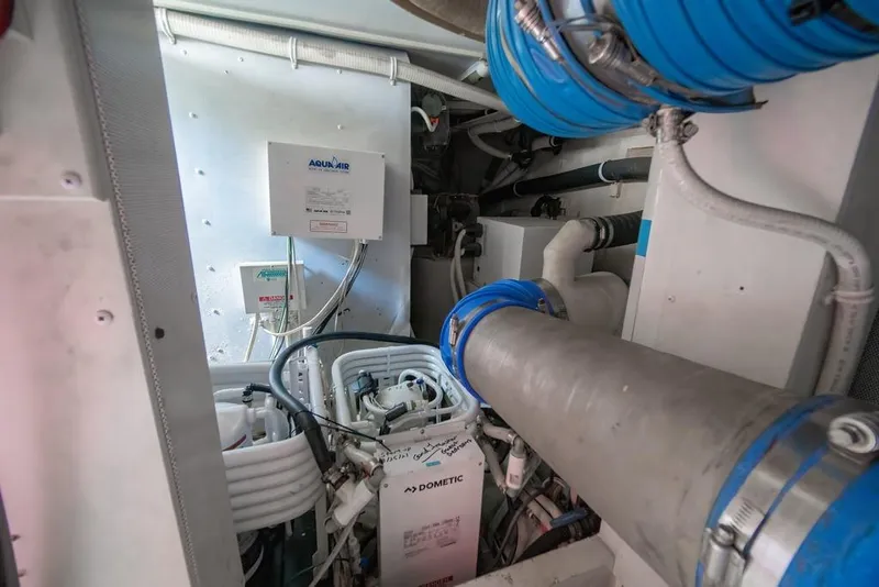 Slide: The Image of Engine room of a 2006 Marquis 59 yacht with Aquair and Dometic equipment. - 54