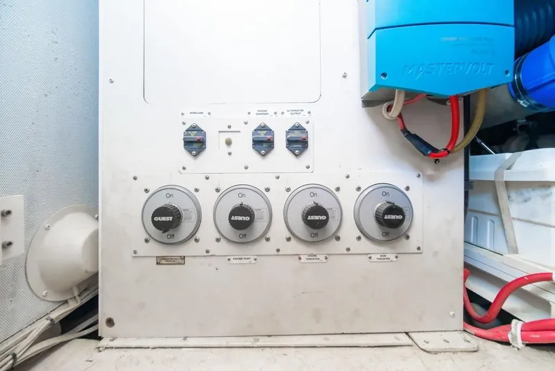 Slide: The Image of Electrical panel with switches and wiring in a 2006 Marquis 59 yacht. - 60