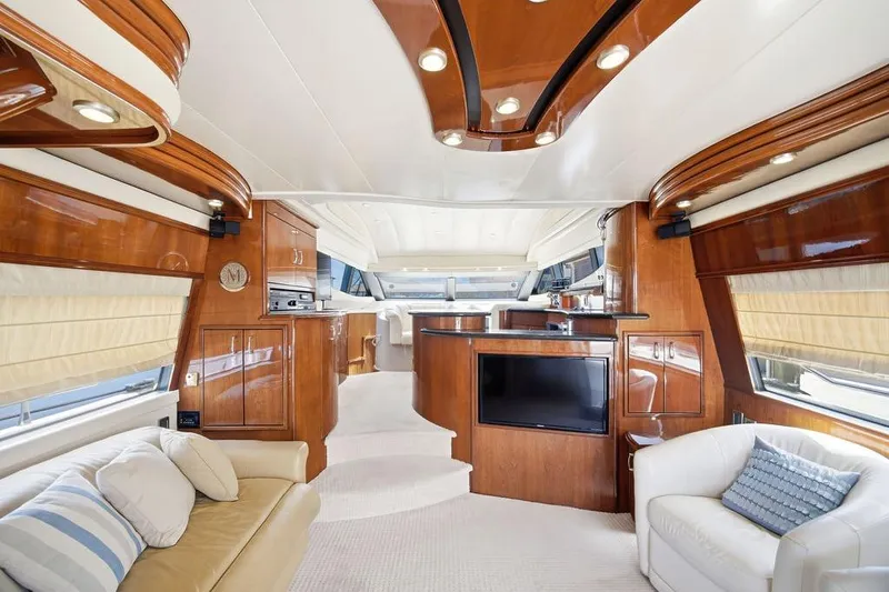 Slide: The Image of Luxurious 2006 Marquis 59 yacht interior with elegant wood finishes and modern amenities. - 8