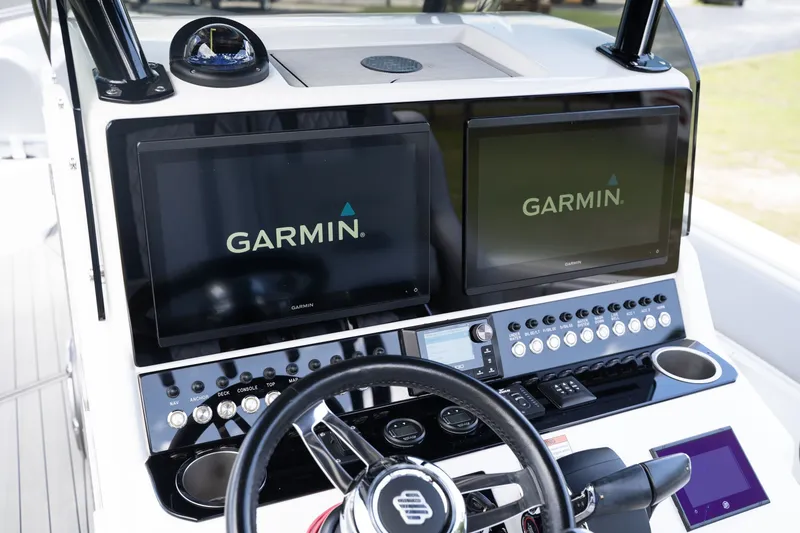 Slide: The Image of 2023 Concept 36 boat console with Garmin screens and controls. - 12