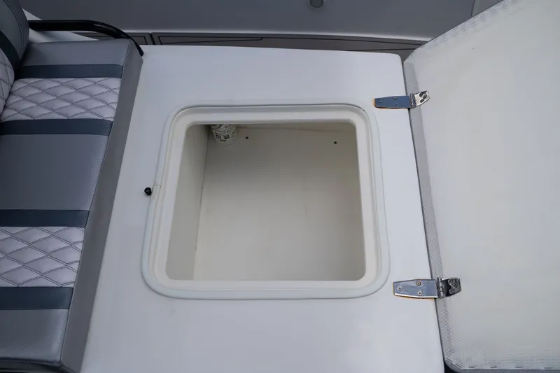 Slide: The Image of Open storage compartment on a 2023 Concept 36 boat. - 21