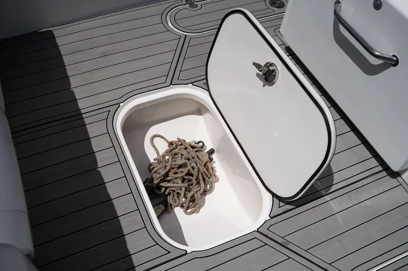 Slide: The Image of Open storage compartment with rope on Concept 36 boat, 2023 model. - 23