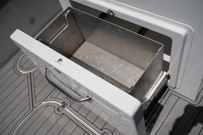 Slide: The Image of Open storage compartment on Concept 36 boat, model 2023. - 25