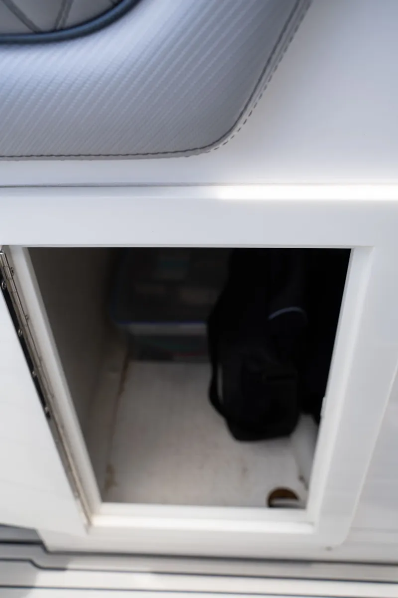 Slide: The Image of Open storage compartment on a 2023 Concept 36 boat. - 29
