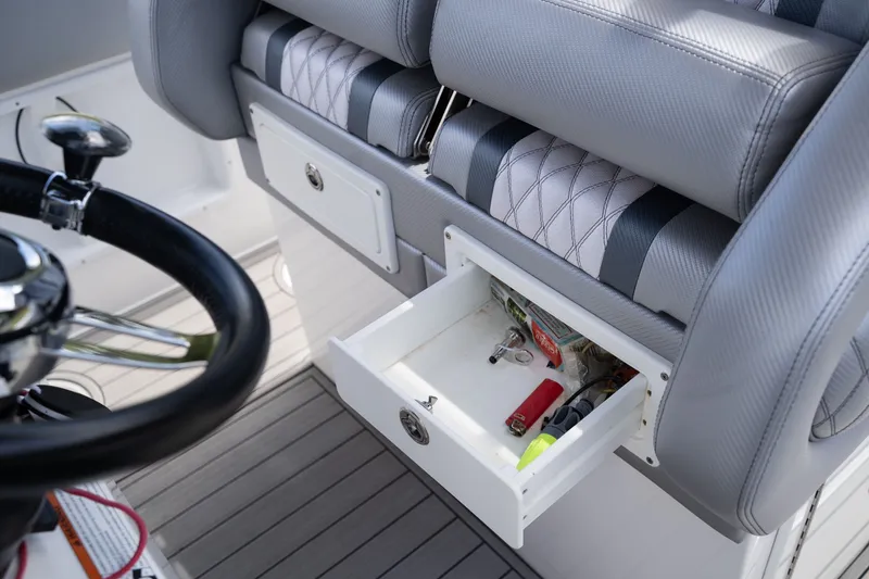 Slide: The Image of Interior of Concept 36 boat with open storage compartment. - 30