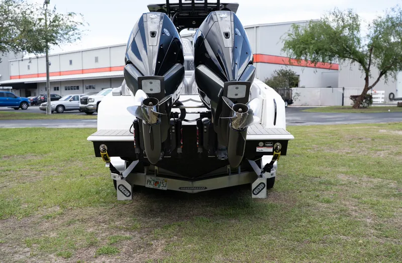 Slide: The Image of Rear view of a 2023 Concept 36 boat with dual outboard motors. - 5