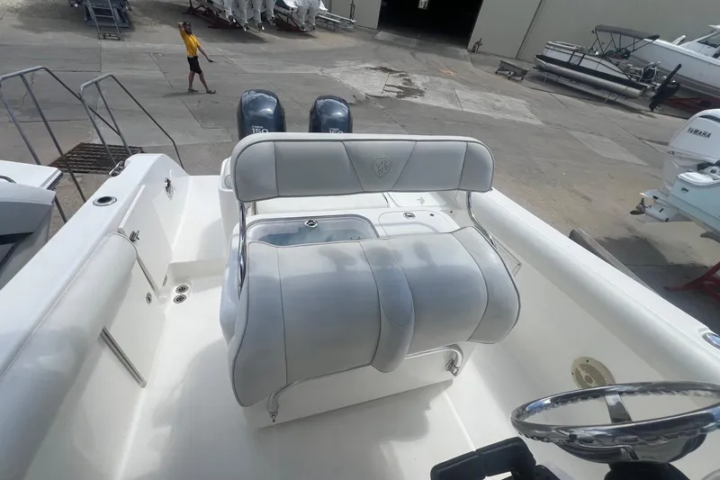 Slide: The Image of 2007 Century 2400 Center Console boat interior with dual engines and seating. - 10