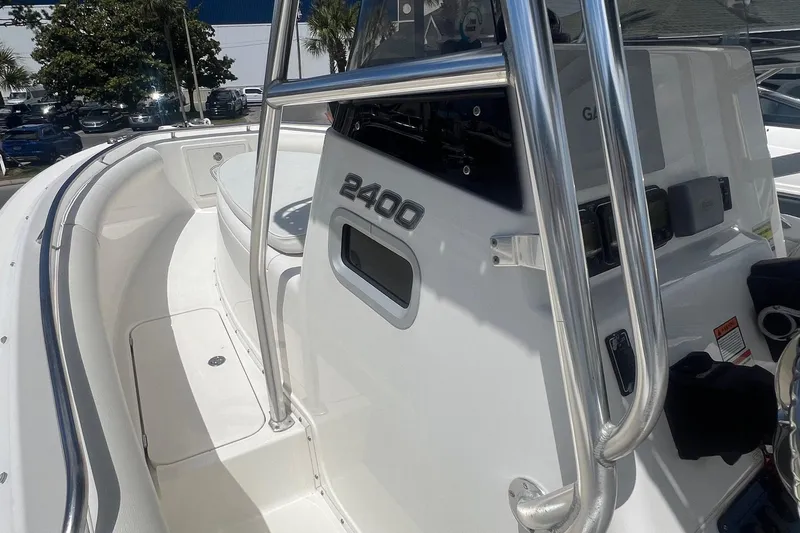 Slide: The Image of 2007 Century 2400 Center Console boat, featuring sleek design and stainless steel railings. - 12