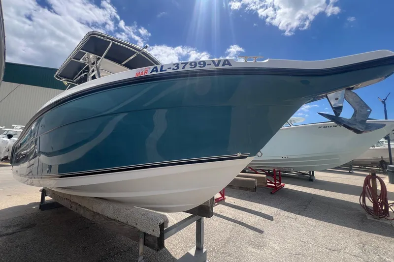 Slide: The Image of 2007 Century 2400 Center Console boat on display under a sunny sky. - 13