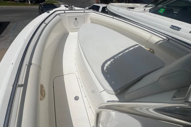 Slide: The Image of 2007 Century 2400 Center Console boat interior with cushioned seating and storage. - 18