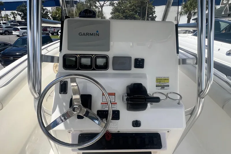 Slide: The Image of Center console of a 2007 Century 2400 boat with Garmin navigation system. - 19