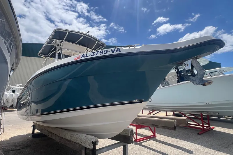 Slide: The Image of 2007 Century 2400 Center Console boat on display under a clear blue sky. - 4