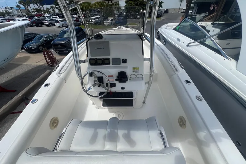Slide: The Image of 2007 Century 2400 Center Console boat interior with steering wheel and Garmin navigation system. - 8