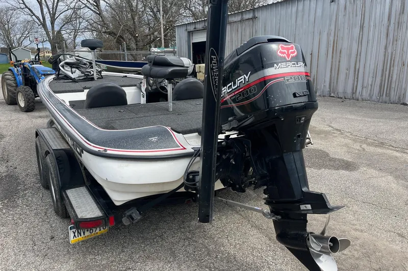 Slide: The Image of 1999 Nitro 896 Savage boat with Mercury 200 engine on trailer. - 4