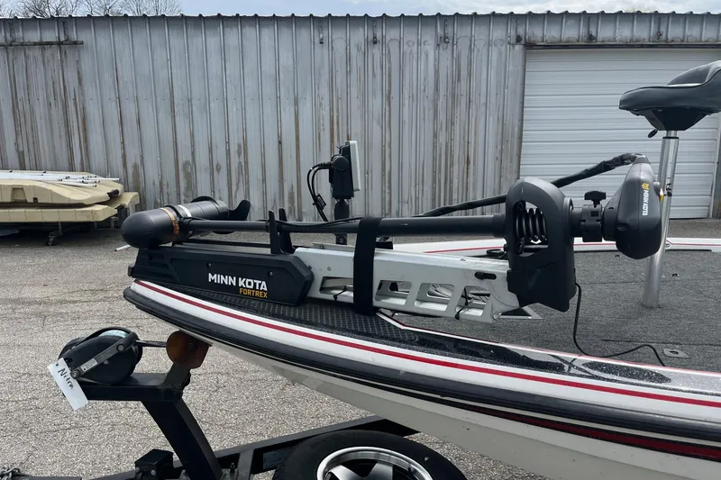 Slide: The Image of 1999 Nitro 896 Savage boat with Minn Kota Fortrex trolling motor, parked outdoors. - 7