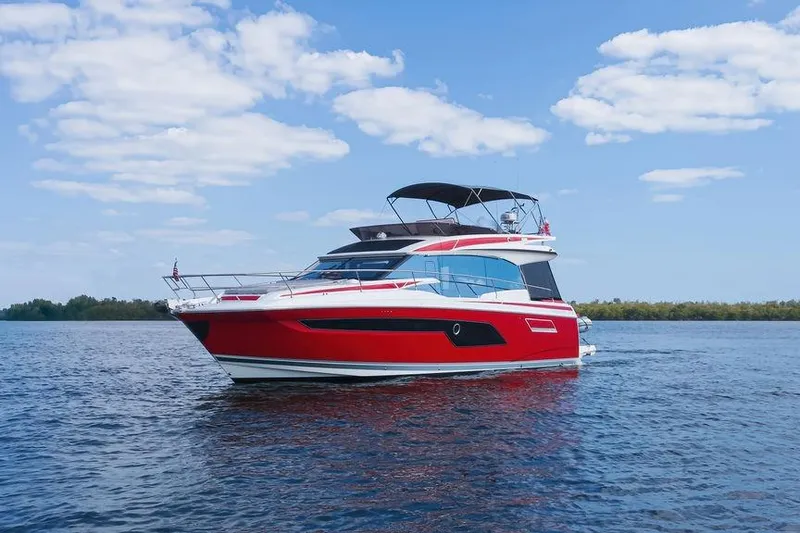 The Image of 2024 Prestige 520 yacht cruising on a sunny day with clear skies. - 0
