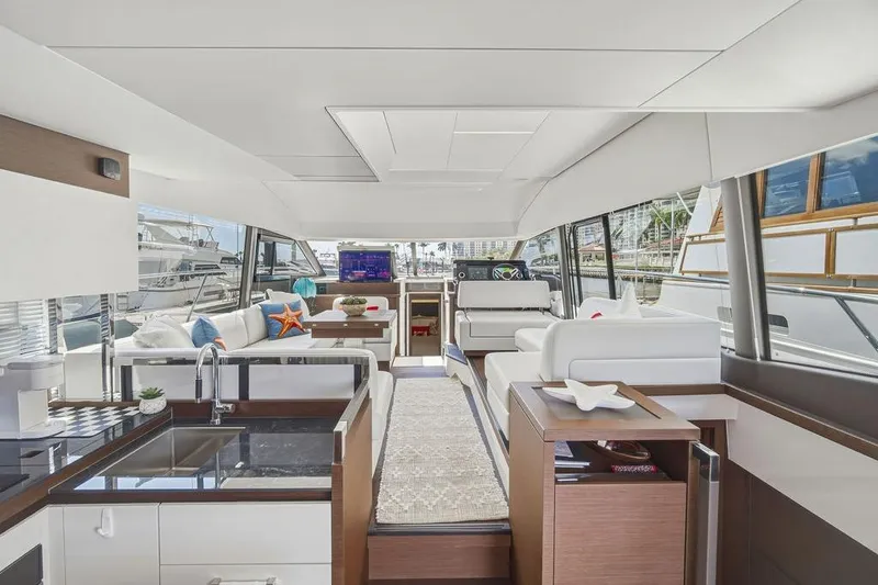 Slide: The Image of Luxurious interior of 2024 Prestige 520 yacht with modern furnishings and panoramic windows. - 21