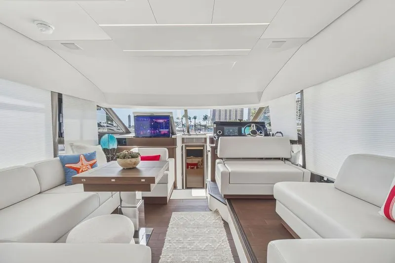 Slide: The Image of Luxurious interior of 2024 Prestige 520 yacht with modern seating and elegant decor. - 22
