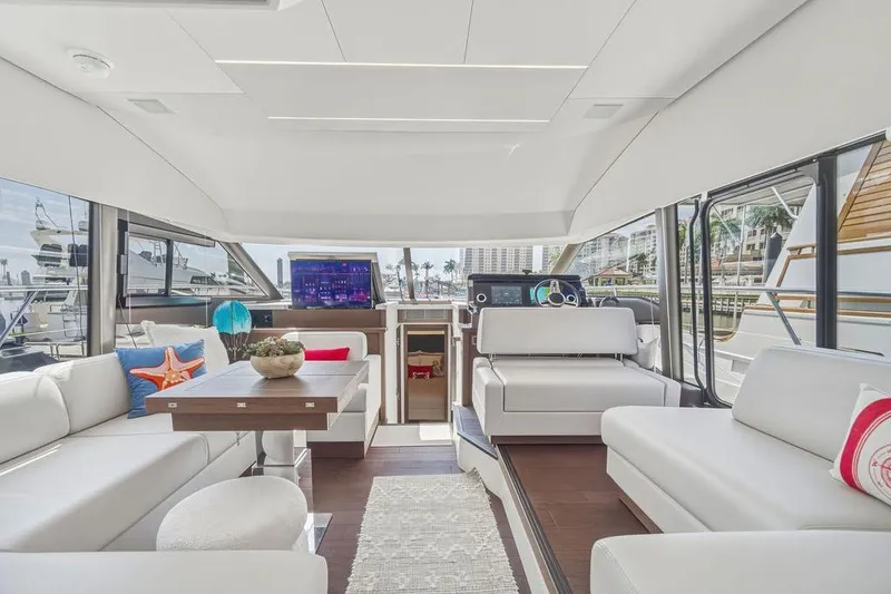 Slide: The Image of Luxurious interior of 2024 Prestige 520 yacht with modern seating and elegant decor. - 23