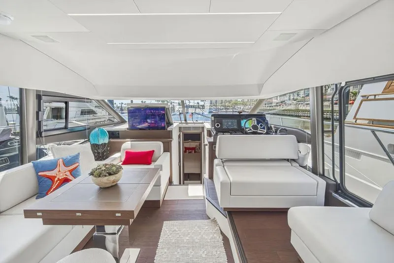 Slide: The Image of Luxurious interior of 2024 Prestige 520 yacht with modern seating and navigation area. - 24