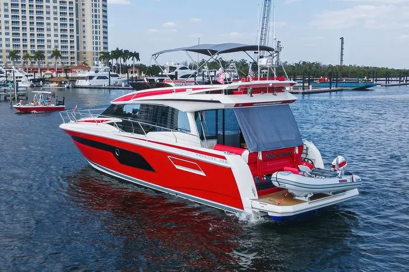 Slide: The Image of Red 2024 Prestige 520 yacht docked in marina, featuring sleek design and modern amenities. - 3