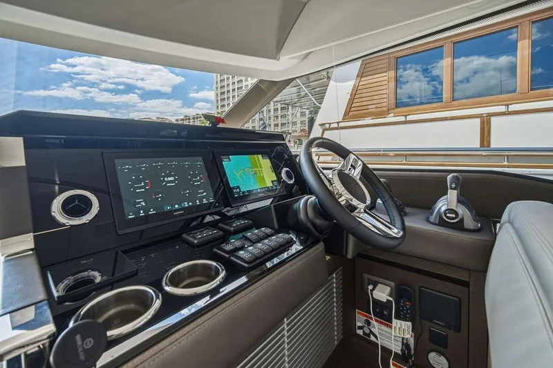 Slide: The Image of Luxurious 2024 Prestige 520 yacht cockpit with advanced navigation systems and sleek design. - 32