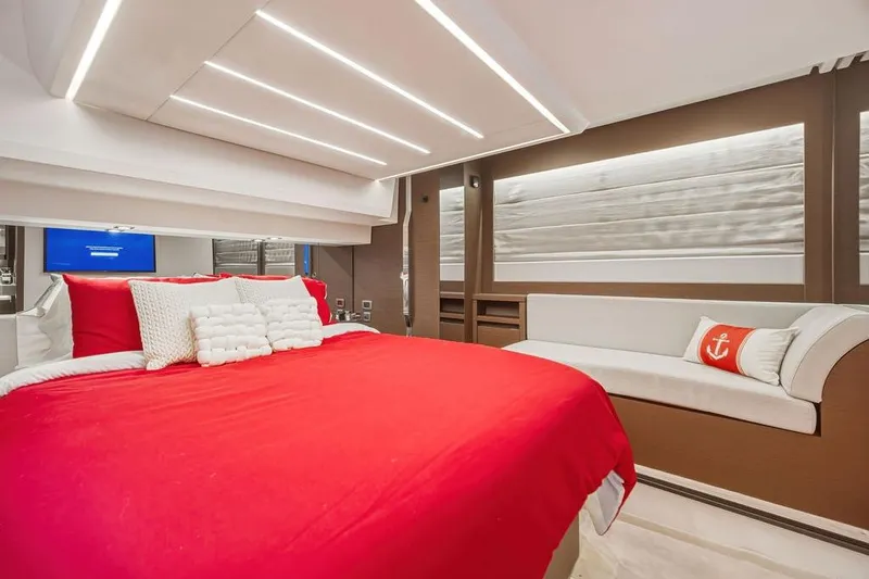 Slide: The Image of Luxurious 2024 Prestige 520 yacht bedroom with red bedding and modern lighting. - 37