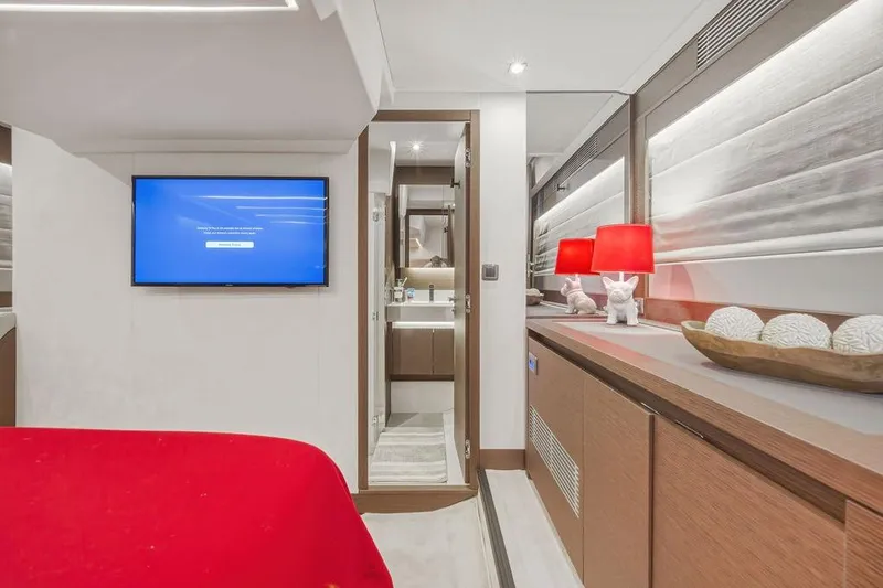 Slide: The Image of Luxurious interior of 2024 Prestige 520 yacht with modern decor and red accents. - 38