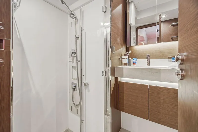 Slide: The Image of Luxurious bathroom in 2024 Prestige 520 yacht, featuring modern shower and sleek vanity design. - 39