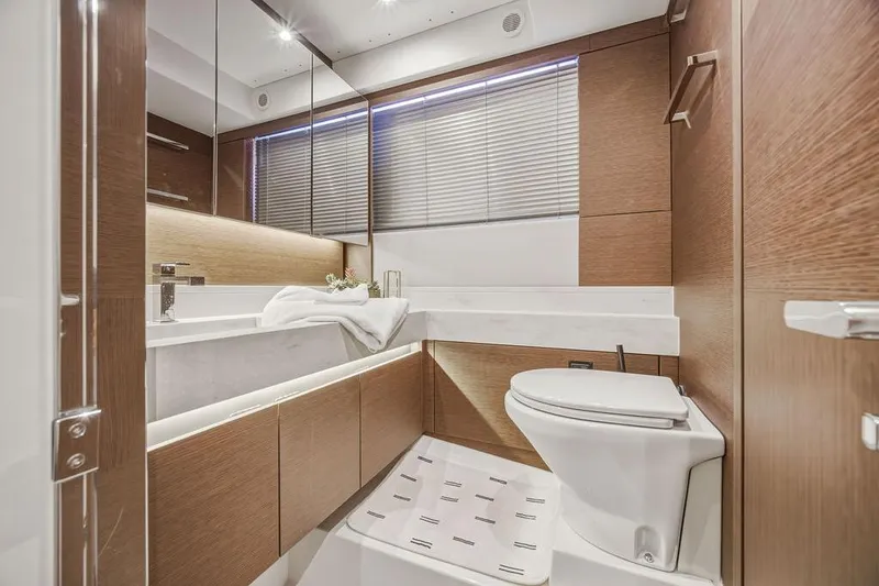 Slide: The Image of Luxurious bathroom interior of 2024 Prestige 520 yacht with modern wood finishes. - 40