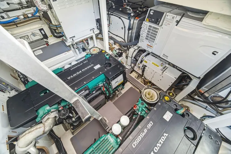 Slide: The Image of Engine room of 2024 Prestige 520 yacht with Volvo Penta engines and Onan generator. - 41