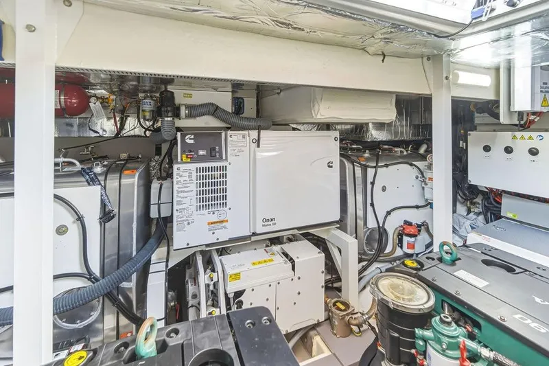 Slide: The Image of Engine room of 2024 Prestige 520 yacht with Onan generator and advanced equipment. - 44