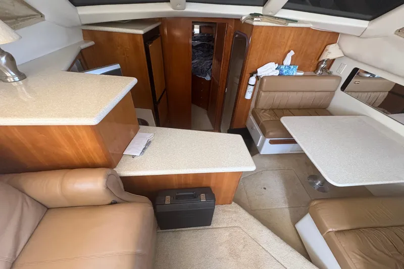 Slide: The Image of Interior of 2002 Carver 356 Aft Cabin Motor Yacht with seating and table. - 12