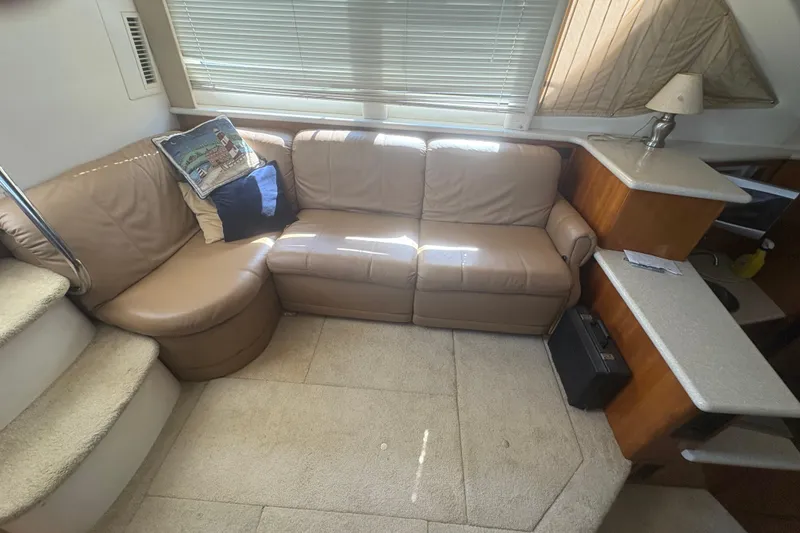 Slide: The Image of Interior of 2002 Carver 356 Aft Cabin Motor Yacht with beige leather seating. - 13