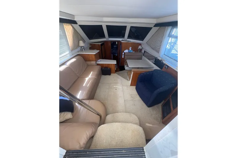 Slide: The Image of Interior of 2002 Carver 356 Aft Cabin Motor Yacht with cozy seating and dining area. - 15