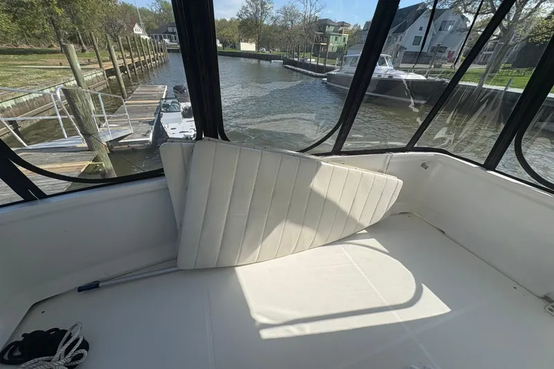 Slide: The Image of 2002 Carver 356 Aft Cabin Motor Yacht interior with dockside view. - 17