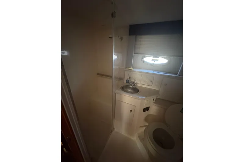Slide: The Image of Bathroom interior of 2002 Carver 356 Aft Cabin Motor Yacht, featuring sink and toilet. - 6