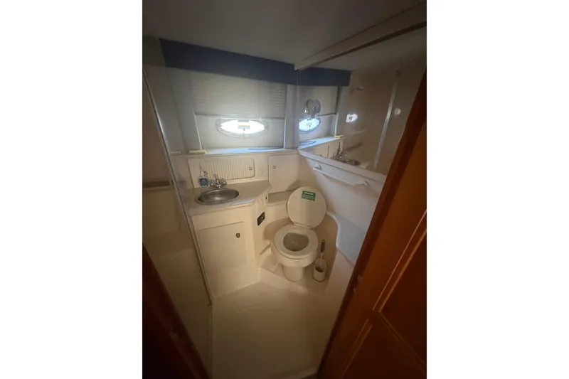 Slide: The Image of Bathroom interior of 2002 Carver 356 Aft Cabin Motor Yacht, featuring sink and toilet. - 7
